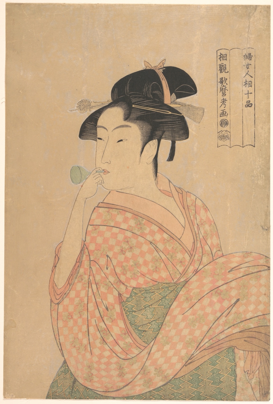 Young Woman Blowing a Popen — Kitagawa Utamaro
